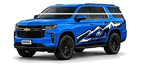 Chevrolet Tahoe in Rapid Blue with Chevrolet performance vinyl graphics, front three-quarter view on a white background.