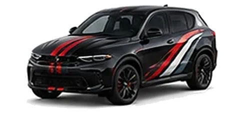 Dodge Hornet in Pitch Black with racing stripes and angular vinyl side graphics, front three-quarter view on a white background.