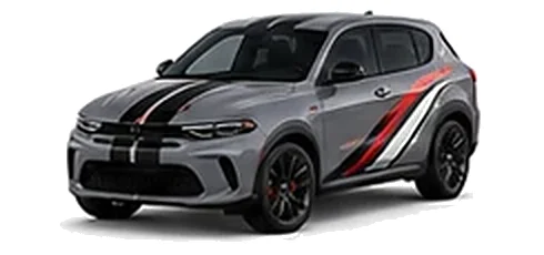Dodge Hornet in Destroyer Grey with racing stripes and angular vinyl side graphics, front three-quarter view on a white background.