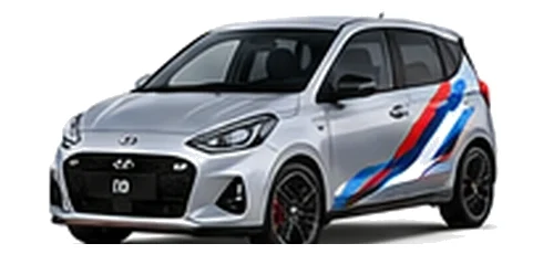Hyundai i10 in Shimmering Silver with Hyundai N-inspired vinyl graphics, front three-quarter view on a white background.