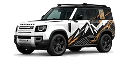 Land Rover Defender 90 in Fuji White with mountain and contour-inspired vinyl side graphics, front three-quarter view on a white background.