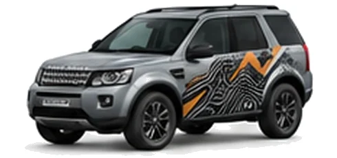 Land Rover Freelander in Eiger Grey with mountain and contour-inspired vinyl side graphics, front three-quarter view on a white background.