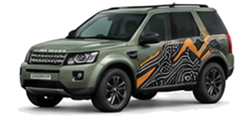 Land Rover Freelander in Pangea Green with mountain and contour-inspired vinyl side graphics, front three-quarter view on a white background.