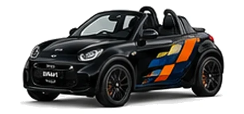 Smart Roadster in Deep Black with orange, white and black pixel-style vinyl side graphics, front three-quarter view on a white background.