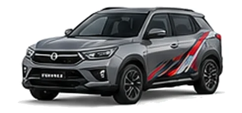SsangYong Korando in Platinum Grey with red, white and black angular vinyl side graphics, front three-quarter view on a white background.