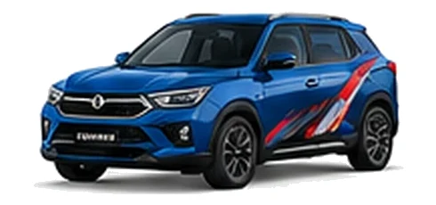 SsangYong Korando in Atlantic Blue with red, white and black angular vinyl side graphics, front three-quarter view on a white background.