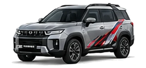 SsangYong Torres in Silent Silver with red, white and black angular vinyl side graphics, front three-quarter view on a white background.