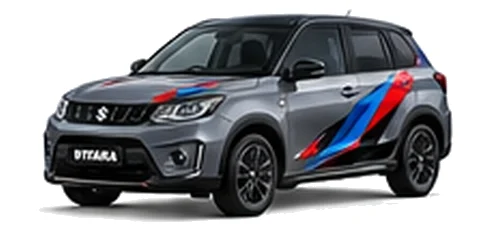 Suzuki Vitara in Mineral Grey with red, blue and black geometric vinyl side graphics, front three-quarter view on a white background.