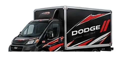 Dodge ProMaster Cutaway in black with custom van vinyl graphics, front three-quarter view.