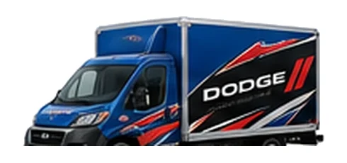 Dodge ProMaster Cutaway in blue with custom van vinyl graphics, front three-quarter view.