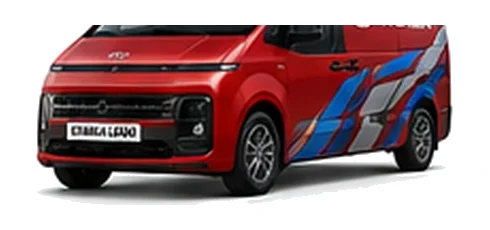 Hyundai Staria Load in red with custom van vinyl graphics, front three-quarter view.