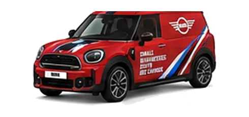 Mini Countryman Commercial in red with custom van vinyl graphics, front three-quarter view.