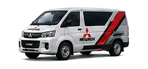 Mitsubishi L400 in white with custom van vinyl graphics, front three-quarter view.