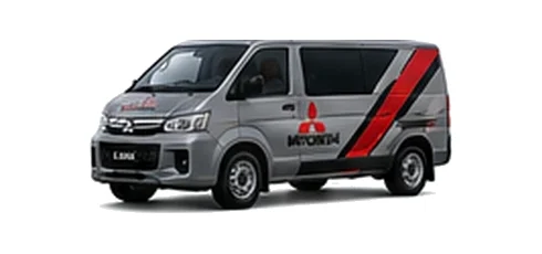 Mitsubishi L400 in grey with custom van vinyl graphics, front three-quarter view.