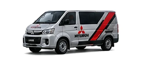 Mitsubishi L400 in silver with custom van vinyl graphics, front three-quarter view.