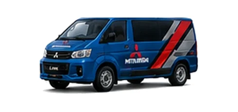 Mitsubishi L400 in blue with custom van vinyl graphics, front three-quarter view.