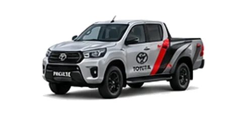 Toyota Hilux in silver with custom van vinyl graphics, front three-quarter view.