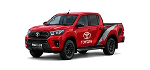 Toyota Hilux in red with custom van vinyl graphics, front three-quarter view.