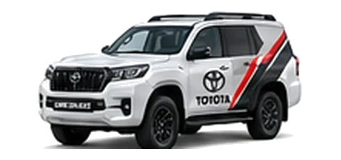 Toyota Land Cruiser Commercial in white with custom van vinyl graphics, front three-quarter view.