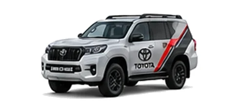 Toyota Land Cruiser Commercial in silver with custom van vinyl graphics, front three-quarter view.