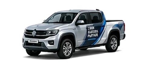 Volkswagen Amarok in silver with custom van vinyl graphics, front three-quarter view.