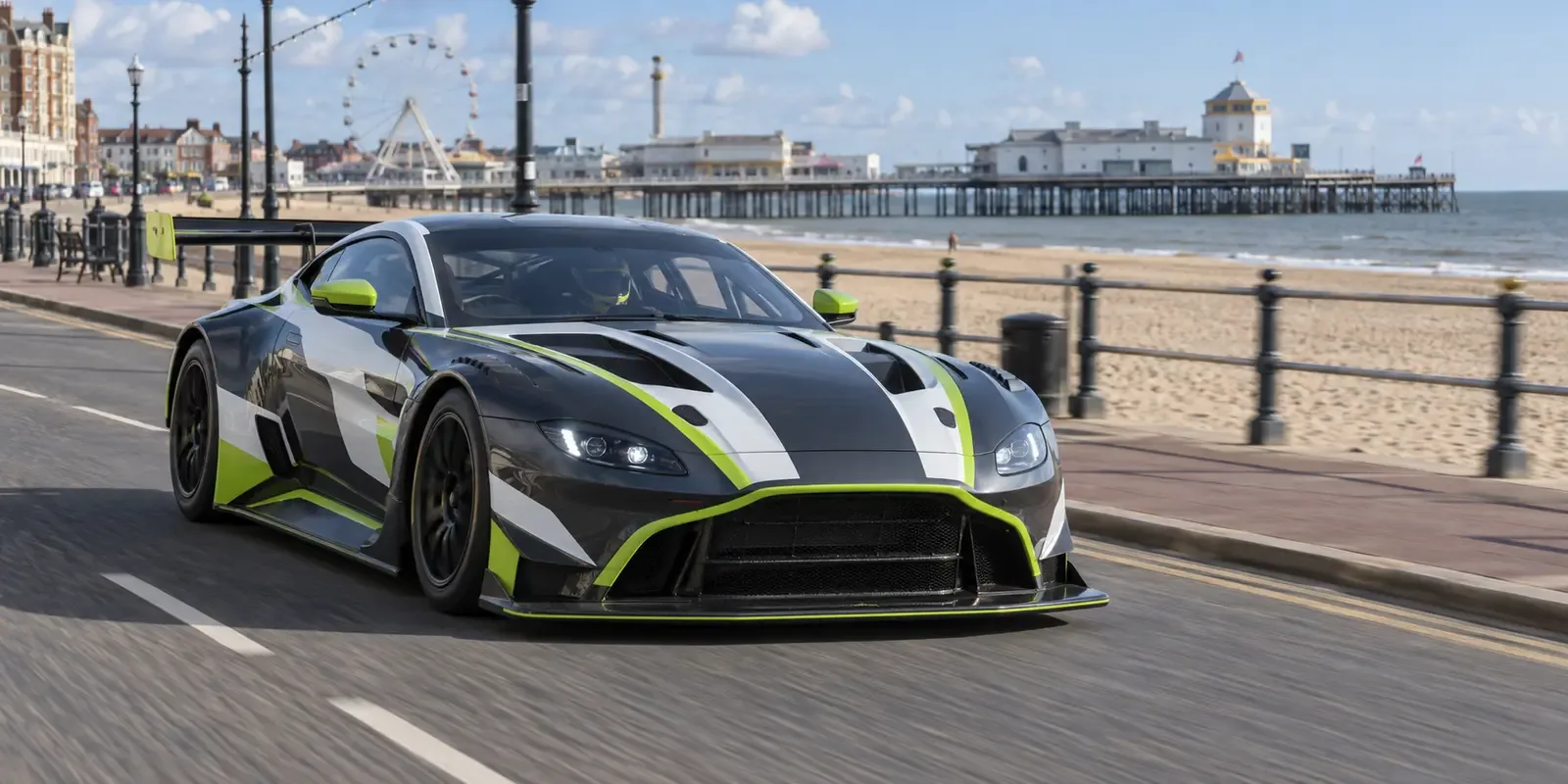 Race-liveried GT car travelling along the Great Yarmouth seafront