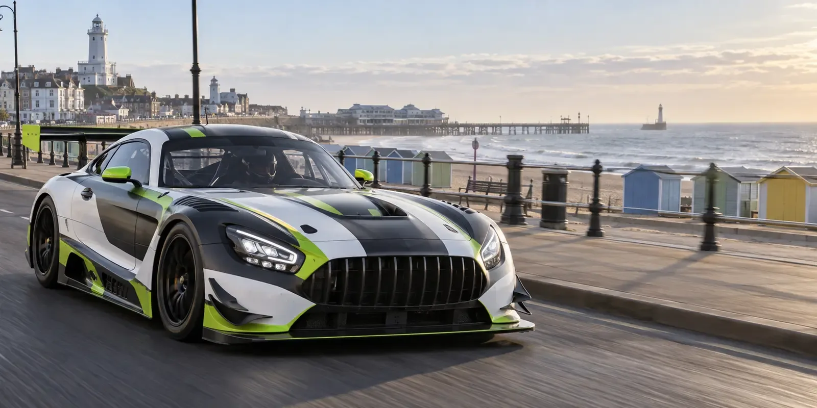Race-liveried GT car travelling along Lowestoft seafront