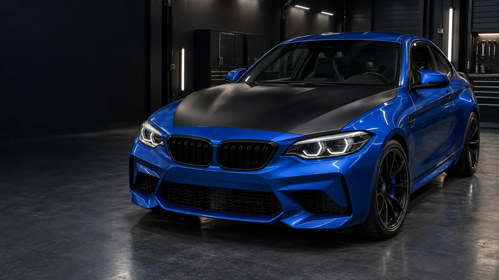Bonnet wrap concept on a blue coupe with a satin black bonnet and blue roof and bodywork